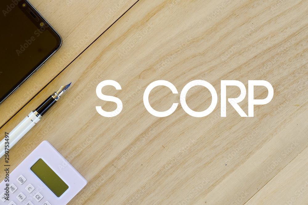 S corp calculator and a pen